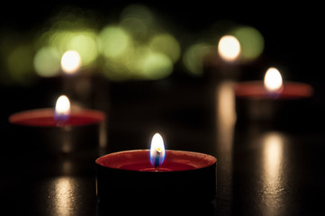 Romantic candles bokeh. Glowing candles from top.
