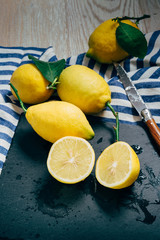fresh lemons with green leaves