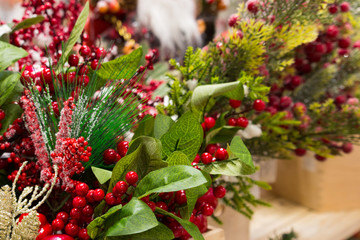 Christmas decoration with pine tree branch, apples and red berries in snow. Merry Christmas decoration background. New Year greeting card. Ripe red berries in frost. Berries of vibrunum.