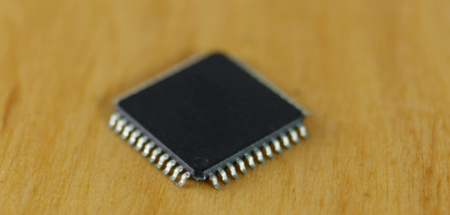 Electronic components: microchip macro image, focused in first pin