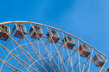Part of a ferris wheel in the sky