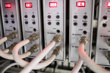 Coaxial television cables connect to TV signal receivers.Telecommunication modulators of video...