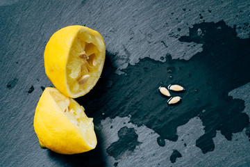 Lemon squeezed on slate chopping board