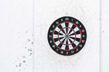 Empty old target dart board. Old used colorful board with lot of shots close up outdoors