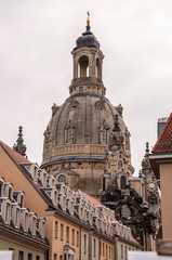 Fototapeta premium Dresden Freauenkirche dome towering over tenement houses