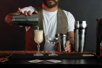 Fototapeta na wymiar Professional barista prepares cocktails