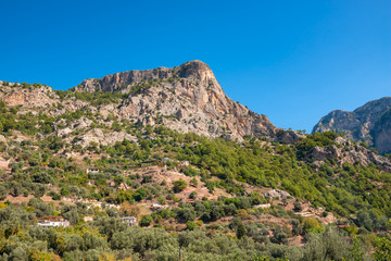 Light rock wall against the blue sky