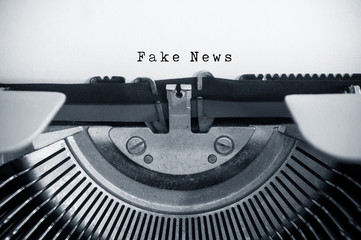 closeup of vintage typewriter with text : Fake News