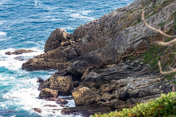 holey rock formation at the coast