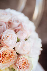 Wedding flowers, bridal bouquet closeup. Decoration made of roses, peonies and decorative plants, close-up, selective focus, nobody, objects