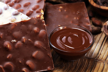 Chocolate bars on table with chocolate tower.