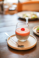 Chia pudding in glass with fresh berry. Superfoods healthy breakfast concept