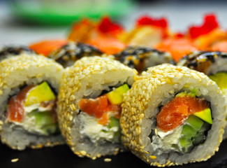beautiful sushi, rolls, with caviar and fresh fish, close-up