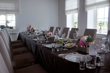 stylish champagne glasses and food appetizers on table at wedding reception. luxury catering at celebrations. serving food and drinks at events concept