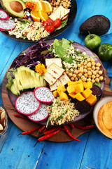 grilled tofu and dragon fruit buddha bowl with vegetable and humus