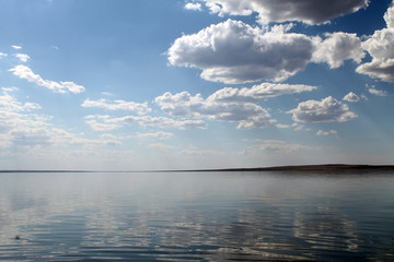the sky reflected in the water, deserted beach lake, summer sky, nature, blue cloud,