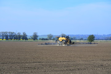 Combine spraying the fields ready for the next harvest 