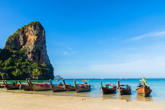Amazing view of beautiful Ao Nang Beach with longtale boats. Location:  Krabi Province, Thailand, Andaman Sea. Artistic picture. Beauty world.