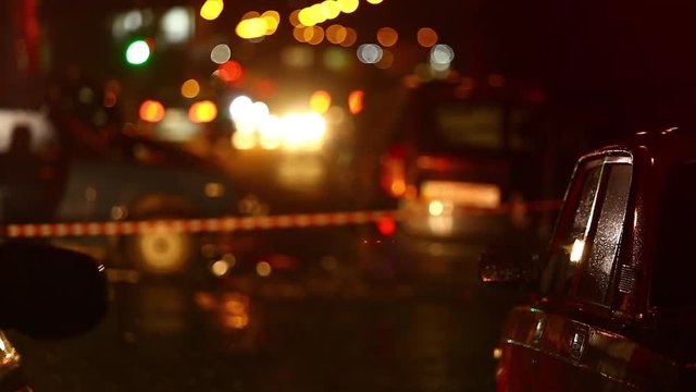 Car accident. Police flashers illuminate the broken cars.
