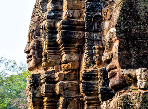 Stone murals and statue Bayon Temple Angkor Thom. Angkor Wat the largest religious monument in the world. Ancient Khmer architecture. Location: Siem Reap, Cambodia.