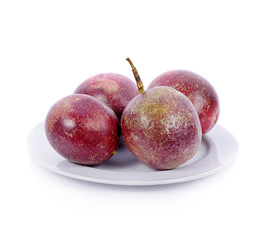 passionfruits in white plate isolated on white background