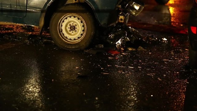 Car accident. Police flashers illuminate the broken cars.