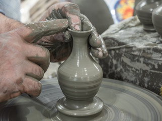 clay modeled with hands by a craftsman to make a vase