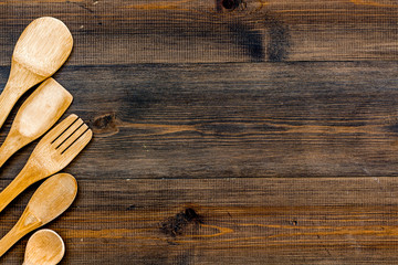 Village tabel with wooden cutlery set on rustic background top view mockup