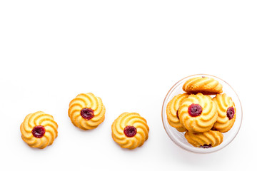 Homemade cookies. Kurabe in glass bowl on white background top view copy space