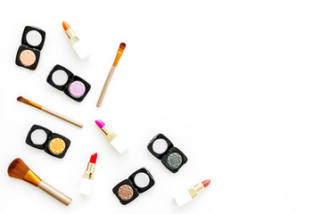 Professional cosmetics set with palette of eyeshadows on white background top view copyspace