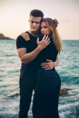 Fototapeta na wymiar young couple in love near the sea