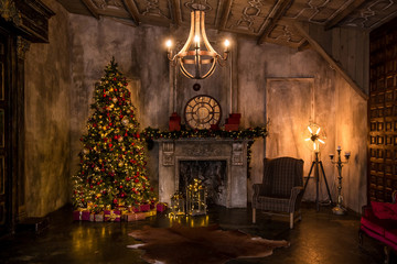 Dark room with christmas interior, Xmas Tree decorated with flashing garland. Darken decor with...