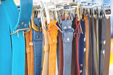 assortment of multi-colored leather belts