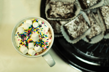 Hot Chocolate with Sprinkles Marshmallows and Snacks 