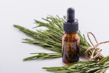 Rosemary essential oil on a white background