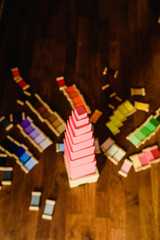 Children playing with pink tower in a Montessori class