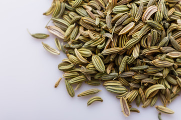 essential oil of fennel seeds on a white background