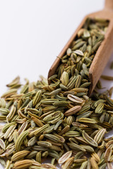 essential oil of fennel seeds on a white background