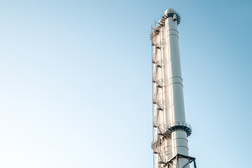 pipes of the plant against the blue sky