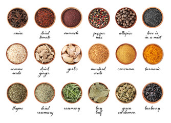 Wooden bowls with different spices and herbs on white background, top view. Large collection with...