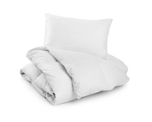 Fototapeta na wymiar Clean blanket and pillow on white background