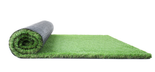 Rolled artificial grass carpet on white background. Exterior element