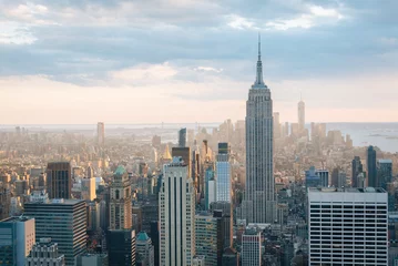 Schilderijen op glas View of the Empire State Building and Midtown Manhattan skyline in New York City © jonbilous
