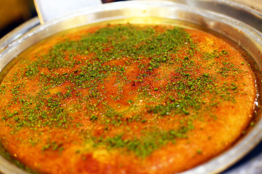 Traditional Turkish dessert 'Kunefe' in the restaurant table in Antakya, Turkey.