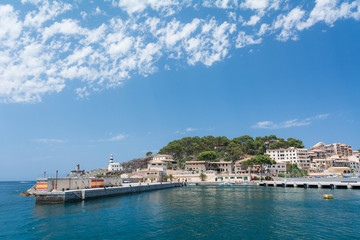 Fototapeta na wymiar Port de Soller, Mallorca, Spain - July 19, 2013: View from the sea of the city, yachts, beach, streets, hotels.