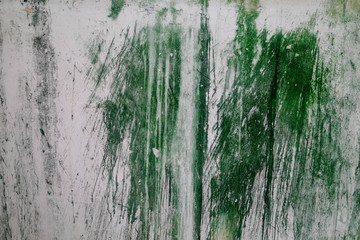 Concrete wall with green drips