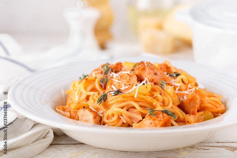 Poster Spaghetti bolognese pasta with tomato sauce, vegetables and chicken meat on white wooden rustic background. Traditional italian food