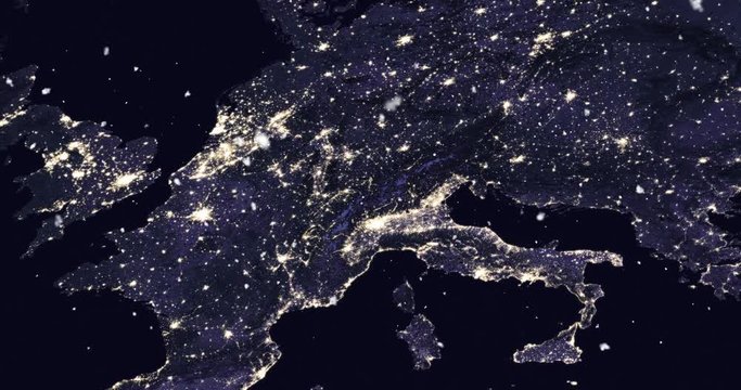 Vertical aerial ascent through light falling snow, over central Europe, at night. Elements of this image furnished by NASA. 