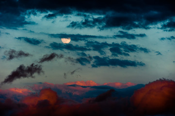 Moon and sunset clouds
