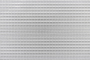 Texture of white hard plastic grate, abstract pattern background
